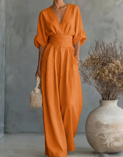 Tuta elegante con scollo a V e gamba larga